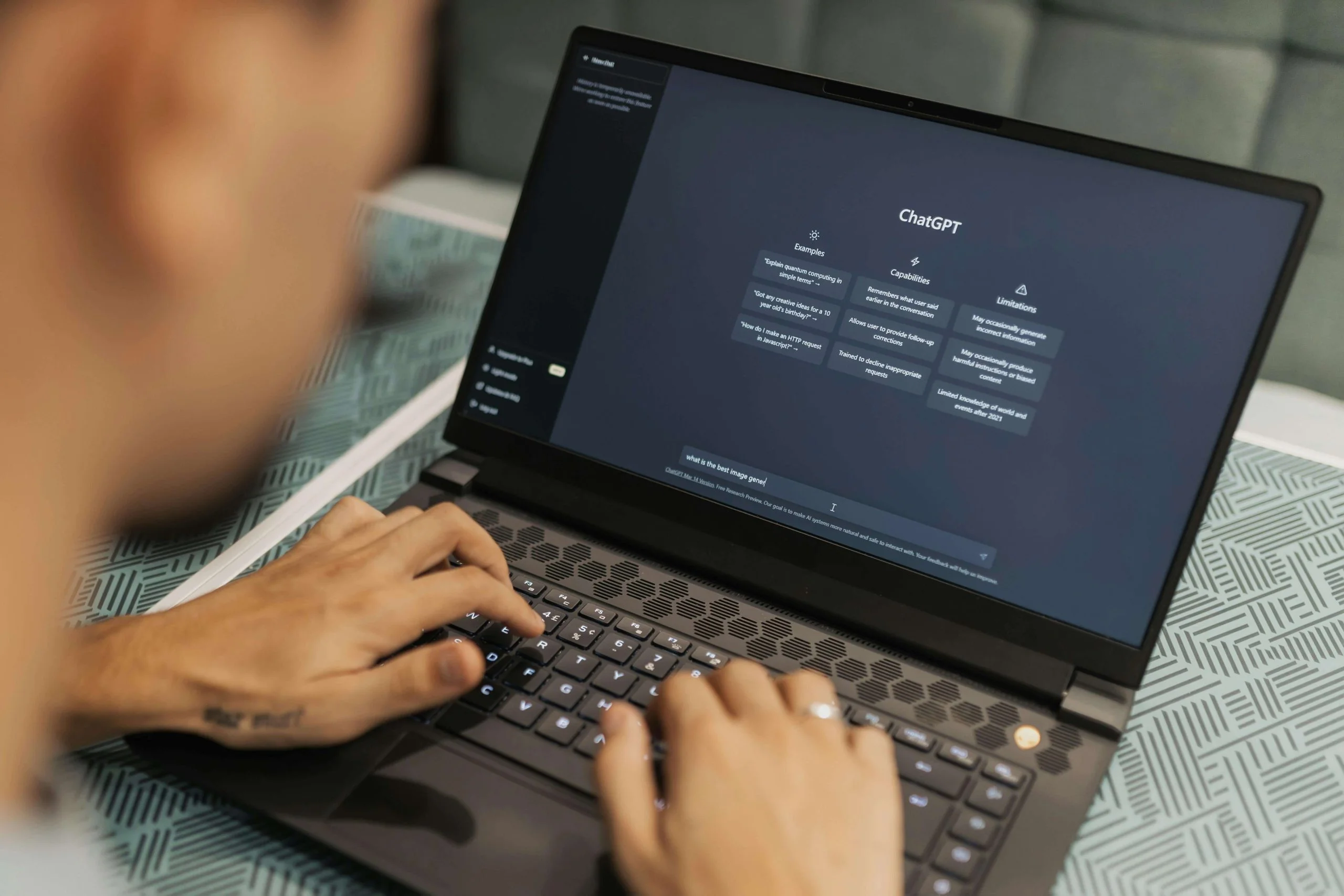 Human using ChatGPT in a laptop