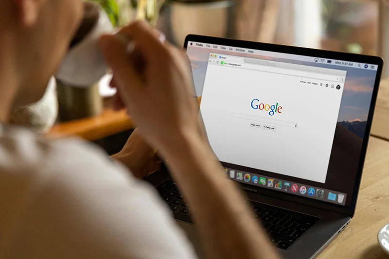 User browsing the internet on a laptop